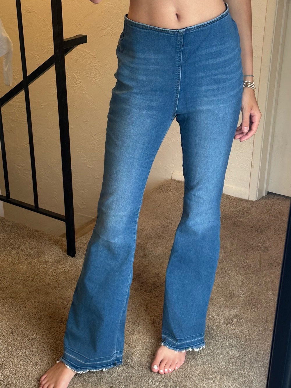 High-Rise Blue Flare Jeans with Frayed Hem